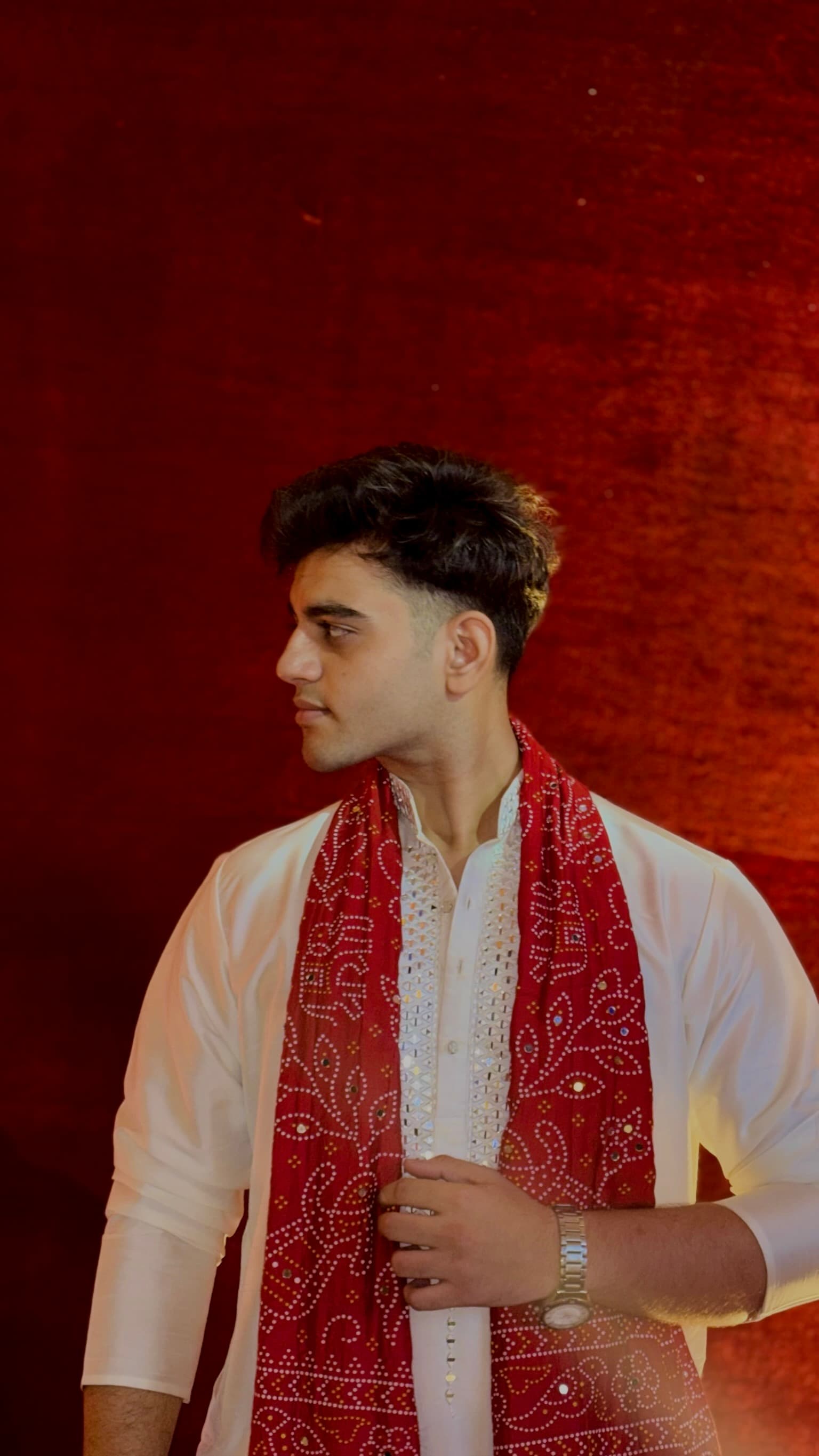Samir Gajjar in red bandhani stole, side profile